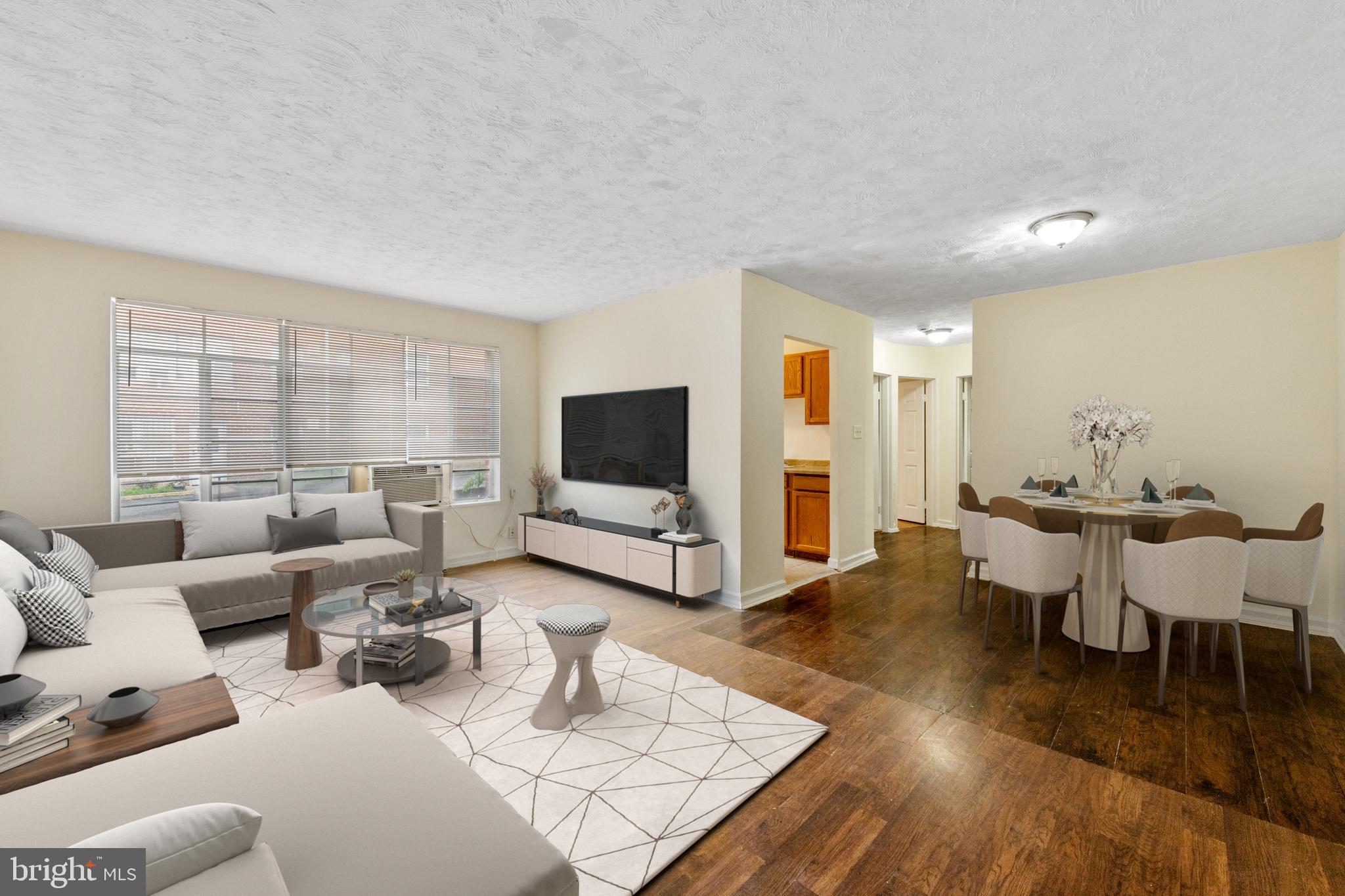 2400 Good Hope Road Southeast, Unit 103 Washington, DC 20020 - Photo 2 of 14 a living room with furniture and a flat screen tv