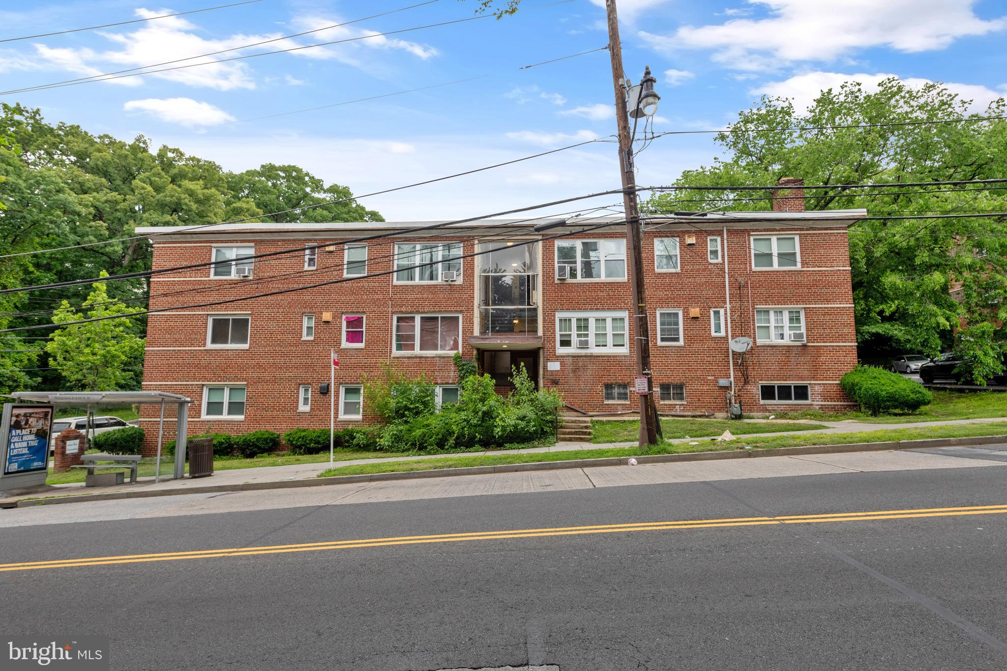 2400 Good Hope Road Southeast, Unit 103 Washington, DC 20020 - Photo 3 of 14 a view of a brick building next to a yard