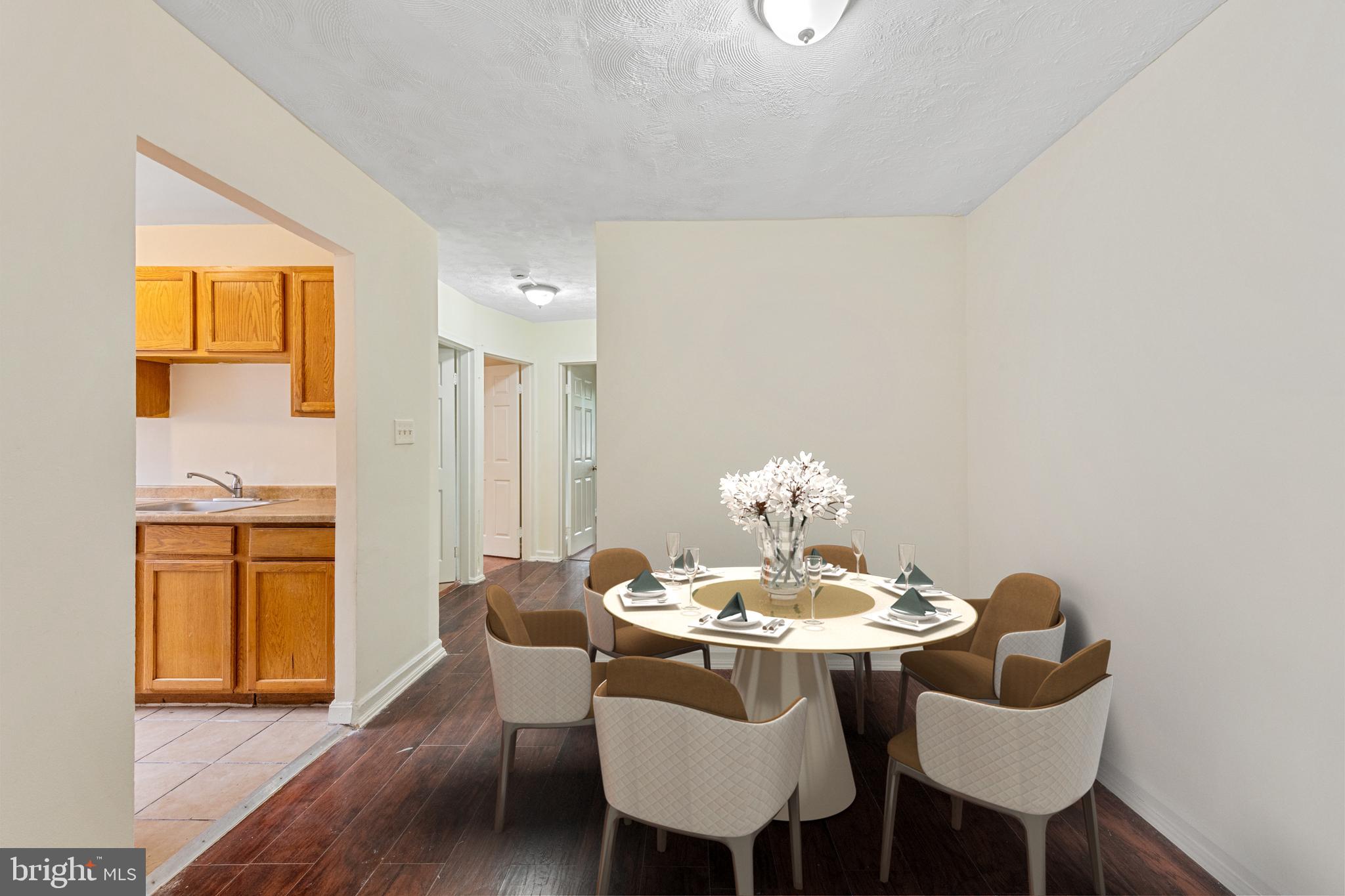 2400 Good Hope Road Southeast, Unit 103 Washington, DC 20020 - Photo 7 of 14 a dining room with furniture and wooden floor