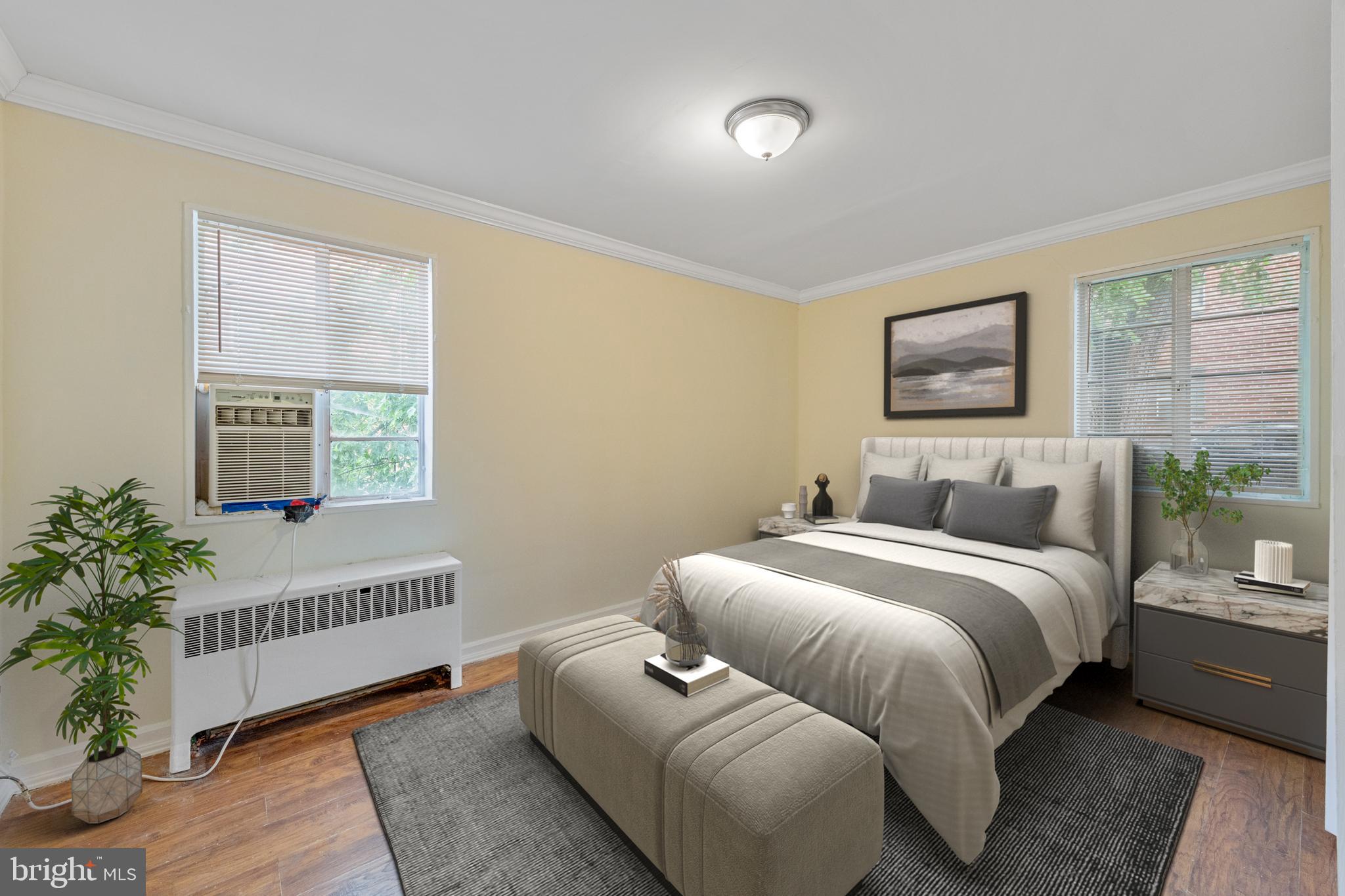 2400 Good Hope Road Southeast, Unit 103 Washington, DC 20020 - Photo 10 of 14 a spacious bedroom with a bed and a window