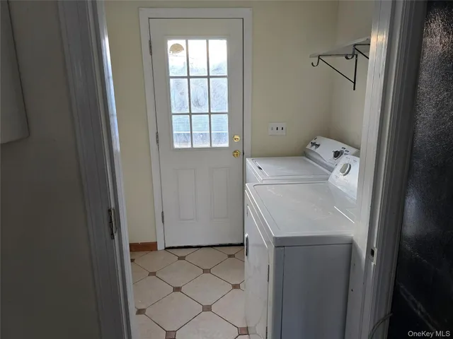 a bathroom with a sink and washing machine