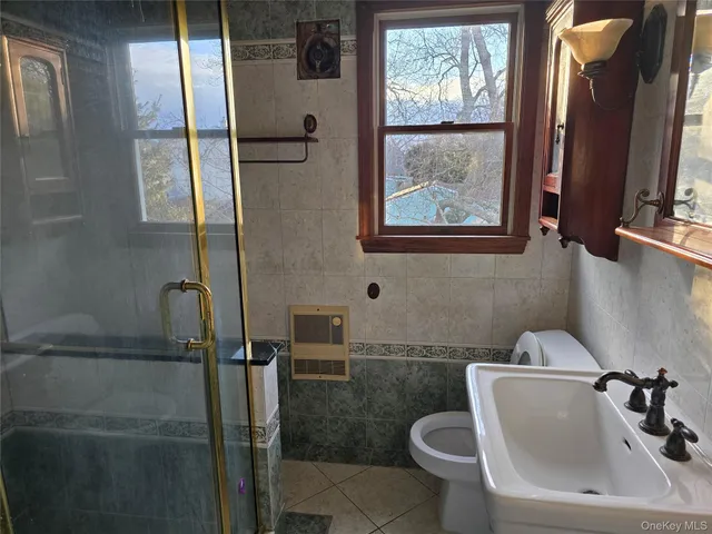 a bathroom with a toilet sink and tub