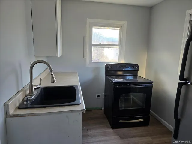 a kitchen with a stove and a sink