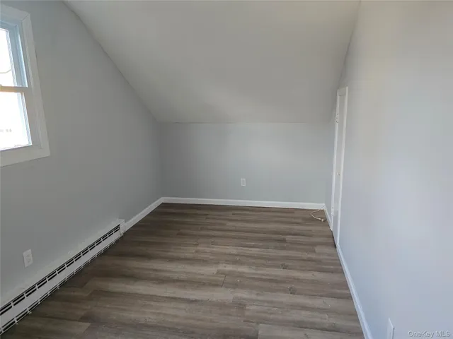 a view of wooden floor and staircase in a room