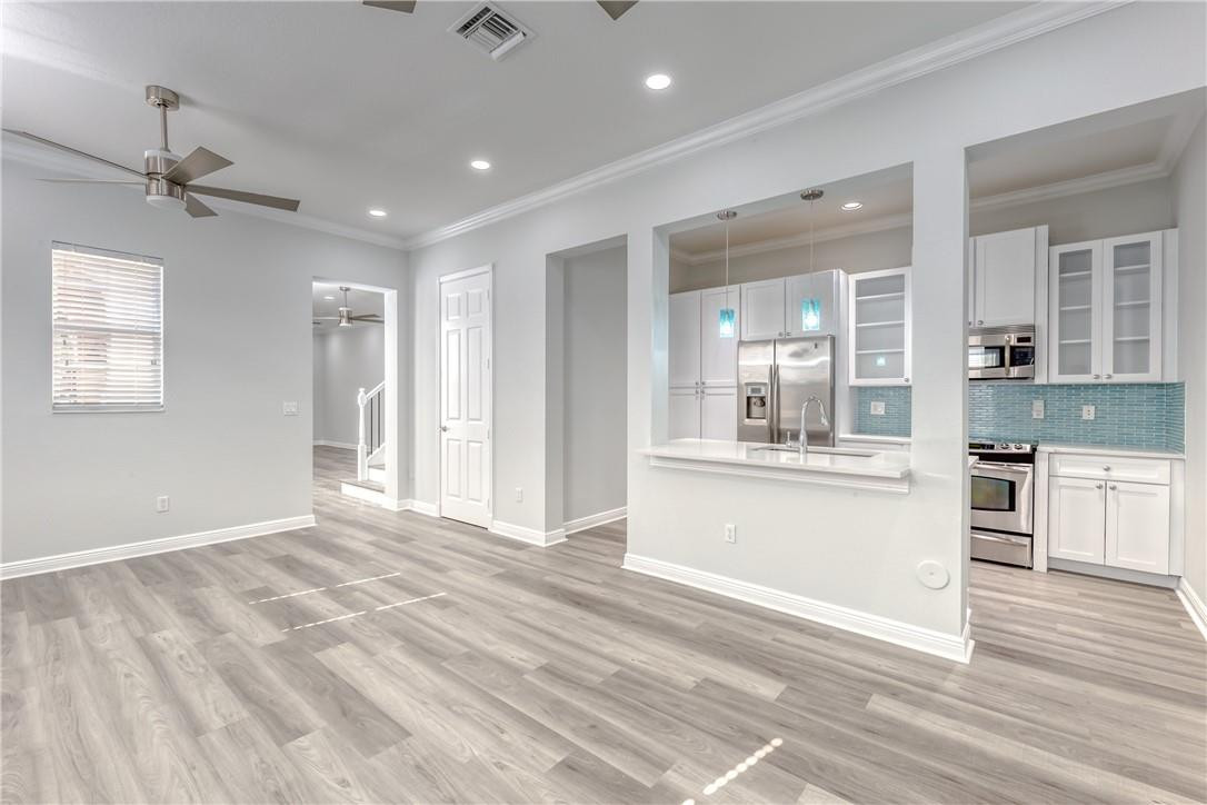 8253 Northwest 8th Way, Unit 8253 Boca Raton, FL 33487 - Photo 15 of 49 Room for barstools at the kitchen island