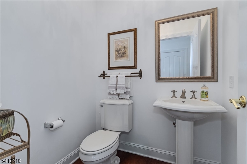1 Brodziak Road Denville, NJ 07834 - Photo 14 of 42 a bathroom with a toilet sink and mirror