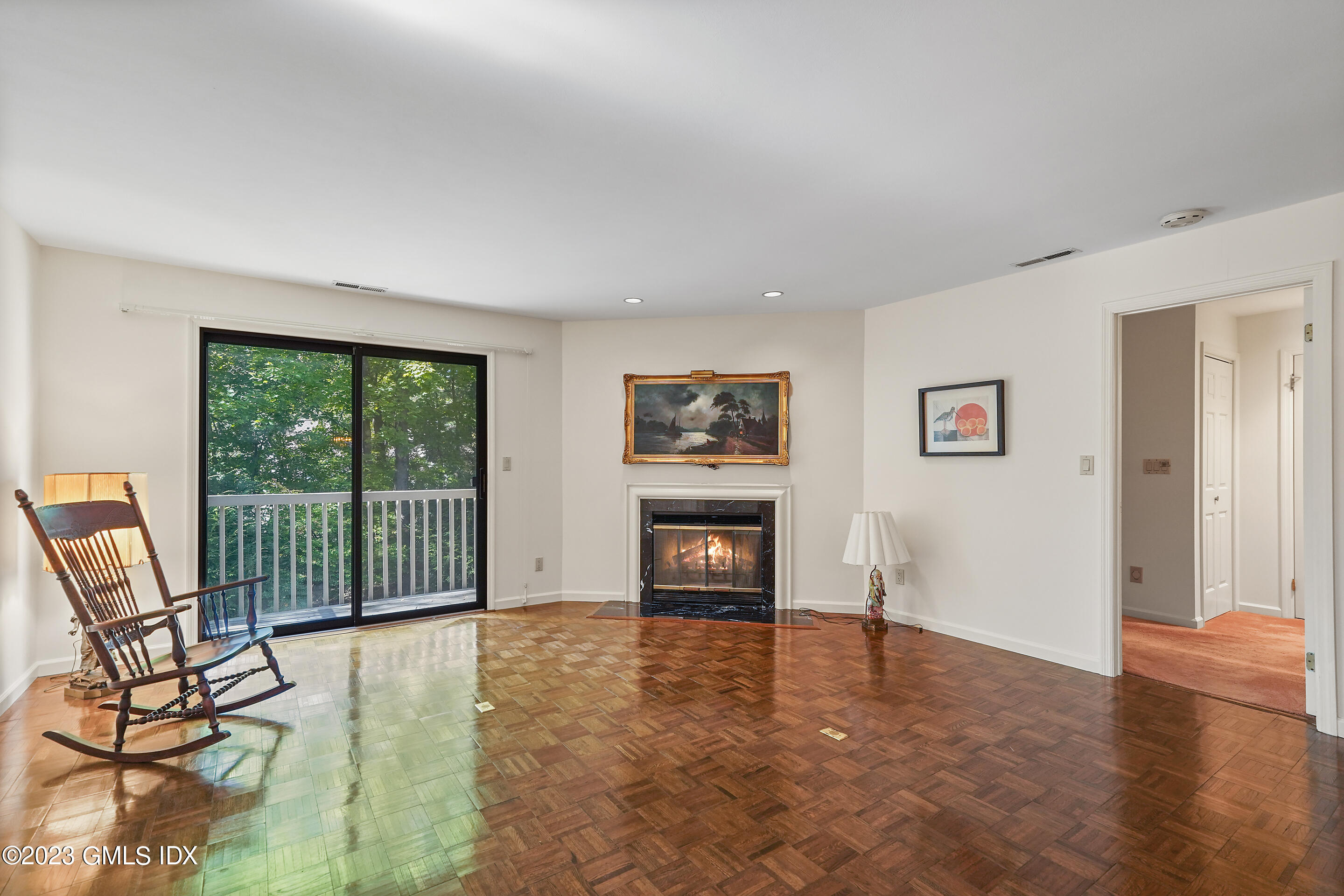 500 River Road, Unit 12 Cos Cob, CT 06807 - Photo 11 of 30 a view of a livingroom with furniture and a fireplace