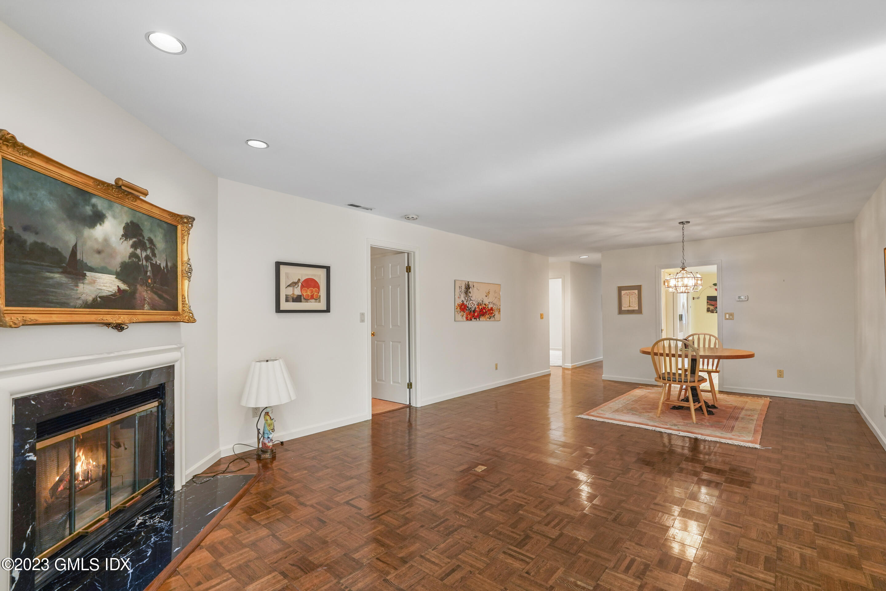 500 River Road, Unit 12 Cos Cob, CT 06807 - Photo 12 of 30 a living room with furniture and a fireplace
