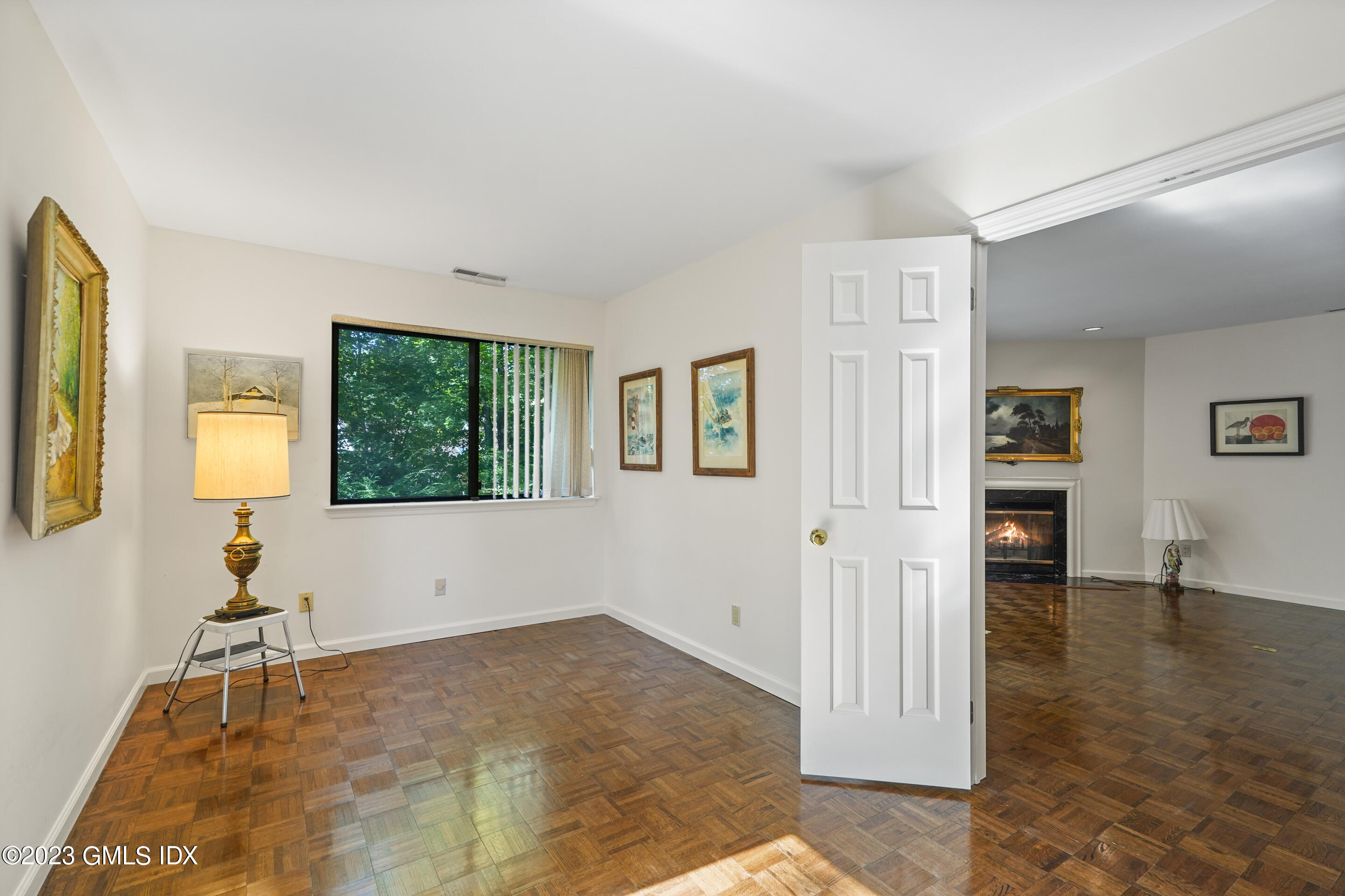 500 River Road, Unit 12 Cos Cob, CT 06807 - Photo 13 of 30 a view of livingroom with hardwood floor and a flat screen tv