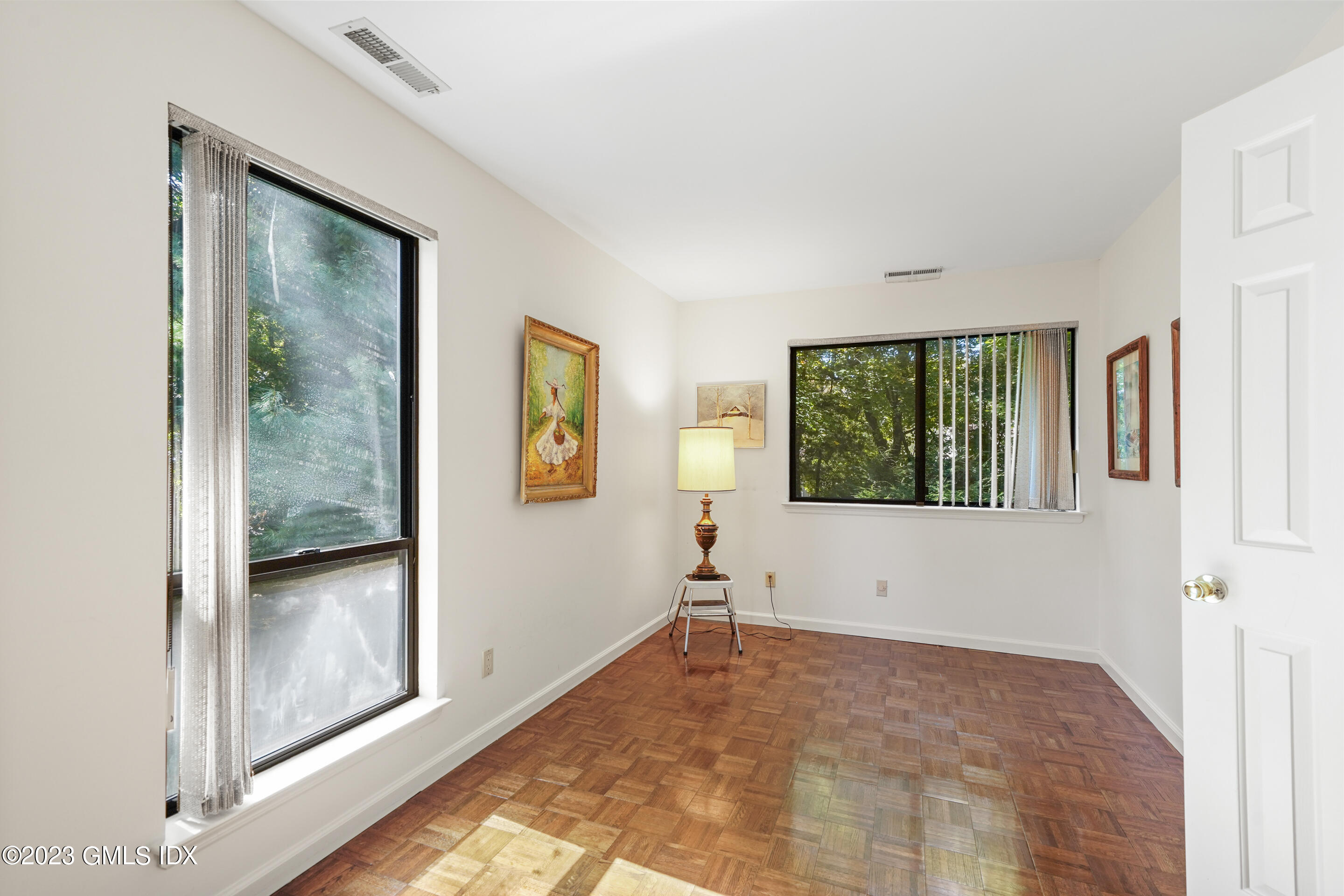 500 River Road, Unit 12 Cos Cob, CT 06807 - Photo 14 of 30 a view of an empty room with windows