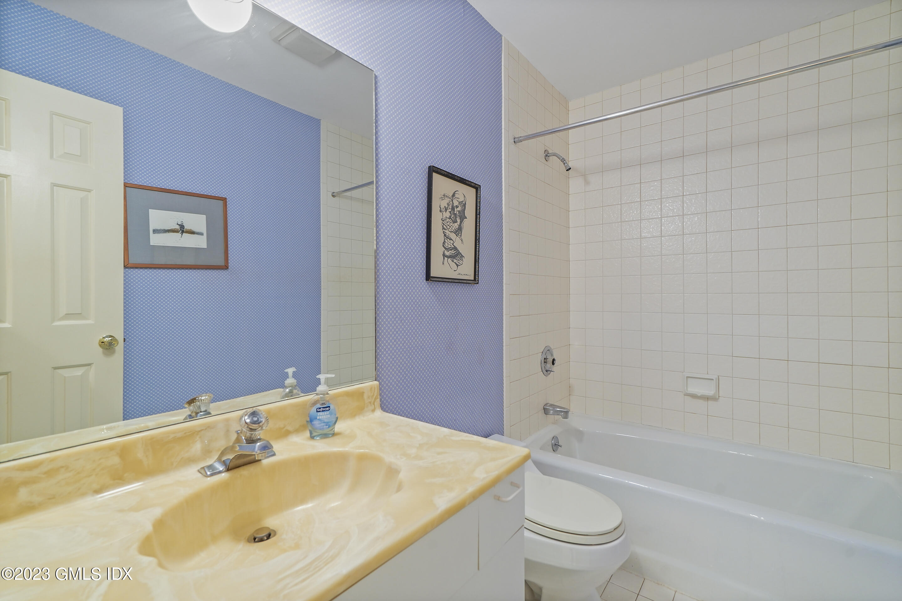500 River Road, Unit 12 Cos Cob, CT 06807 - Photo 18 of 30 a bathroom with a sink a toilet and a bathtub