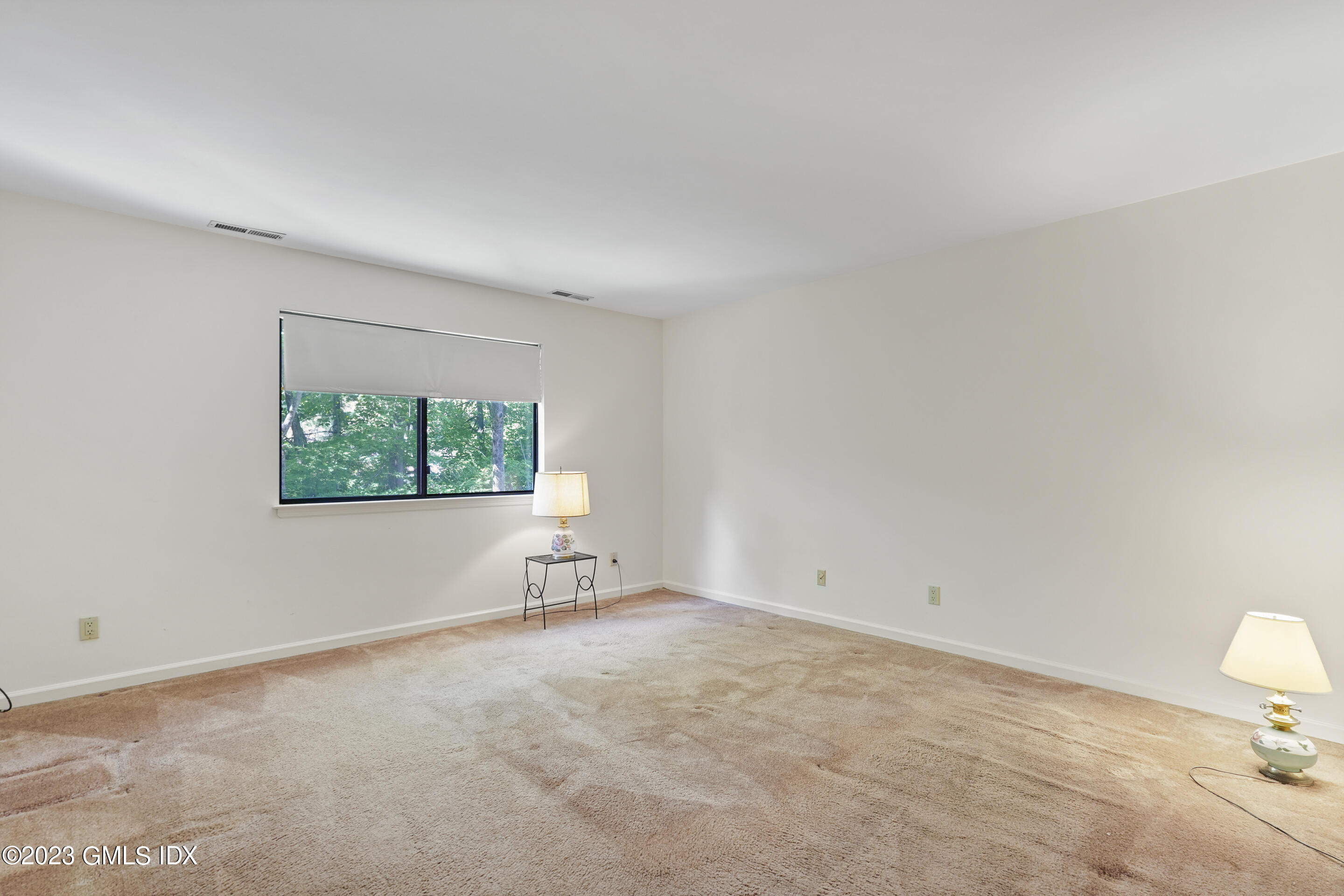 500 River Road, Unit 12 Cos Cob, CT 06807 - Photo 19 of 30 an empty room with windows