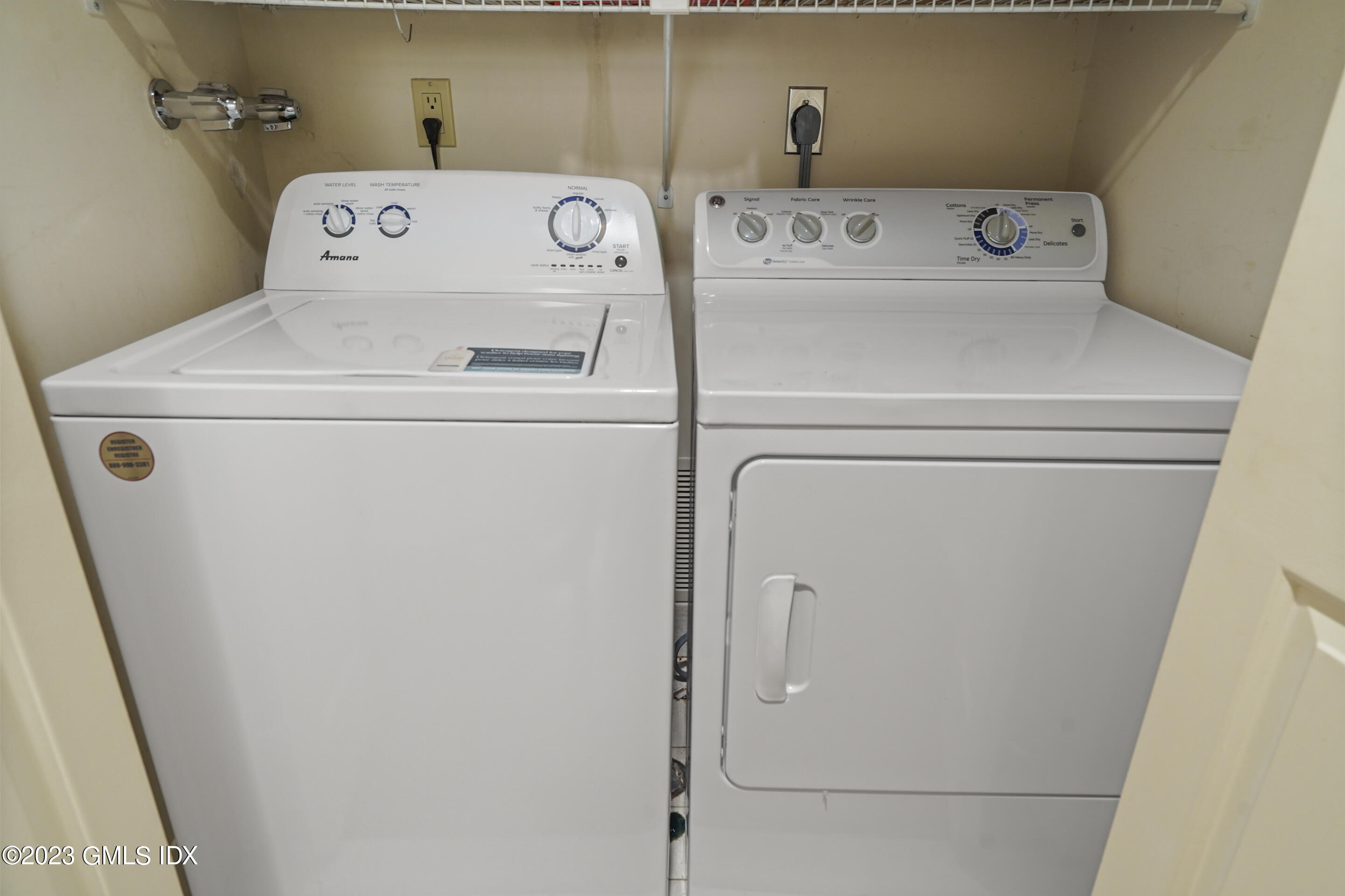 500 River Road, Unit 12 Cos Cob, CT 06807 - Photo 24 of 30 a utility room with dryer and washer