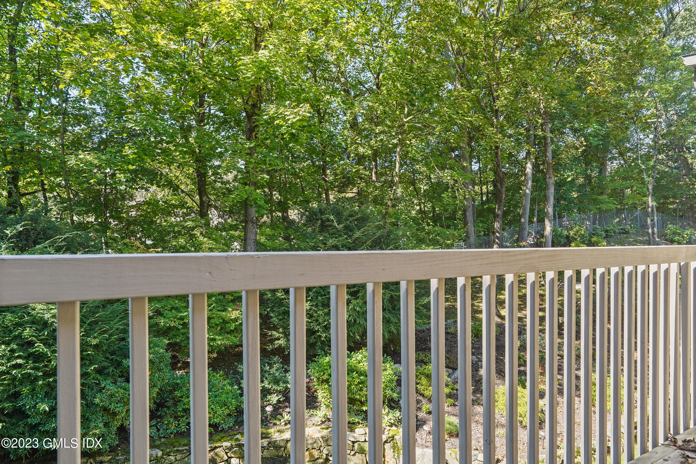 500 River Road, Unit 12 Cos Cob, CT 06807 - Photo 25 of 30 a view of a wooden fence