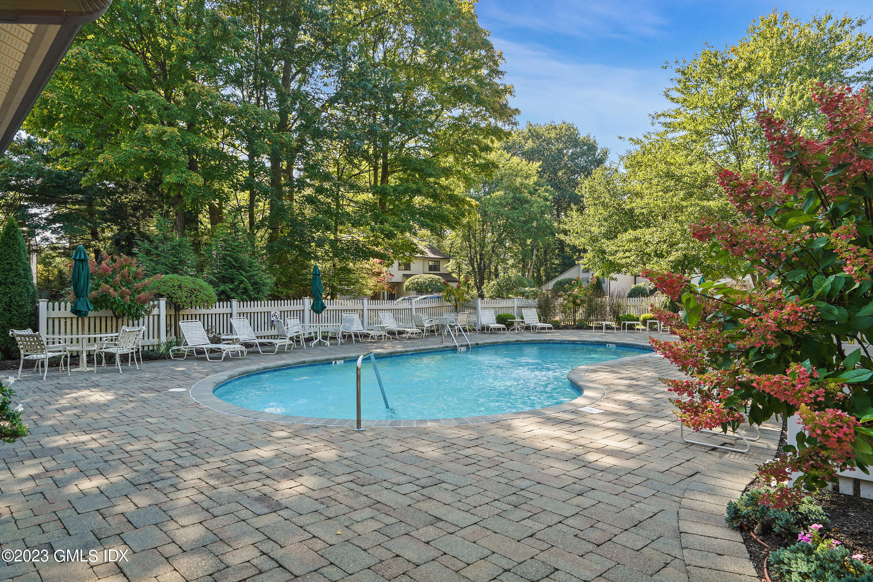 500 River Road, Unit 12 Cos Cob, CT 06807 - Photo 28 of 30 a view of a swimming pool with a patio