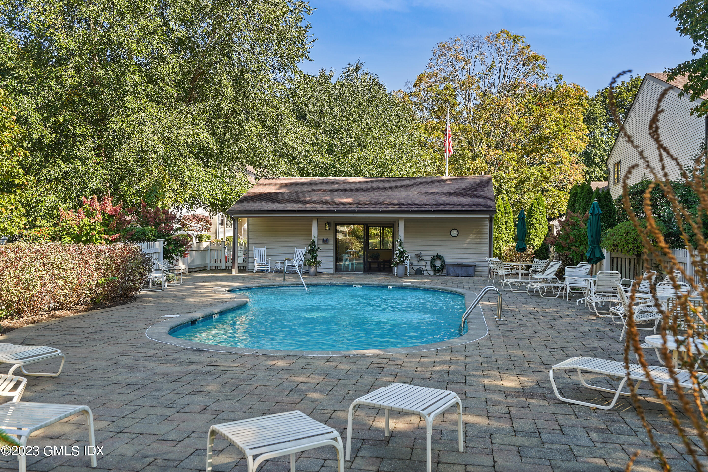 500 River Road, Unit 12 Cos Cob, CT 06807 - Photo 29 of 30 a view of a house with backyard porch and sitting area