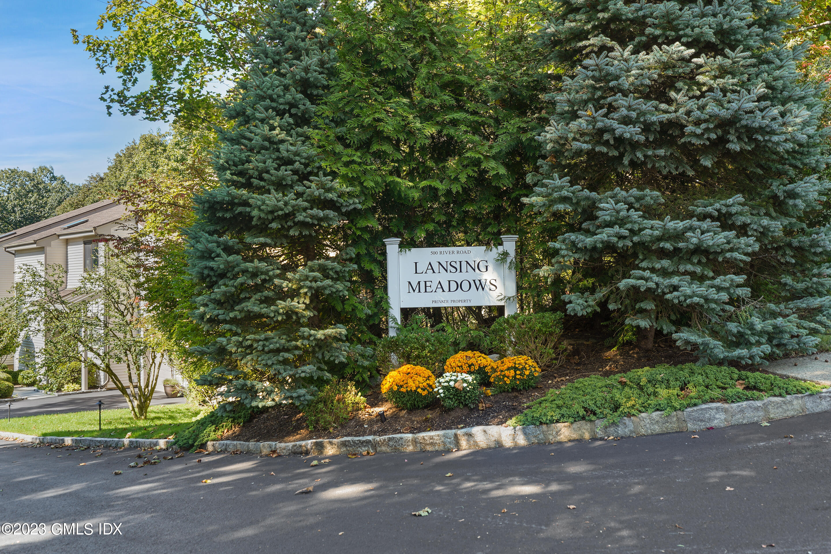 500 River Road, Unit 12 Cos Cob, CT 06807 - Photo 30 of 30 a sign that is sitting on a brick wall