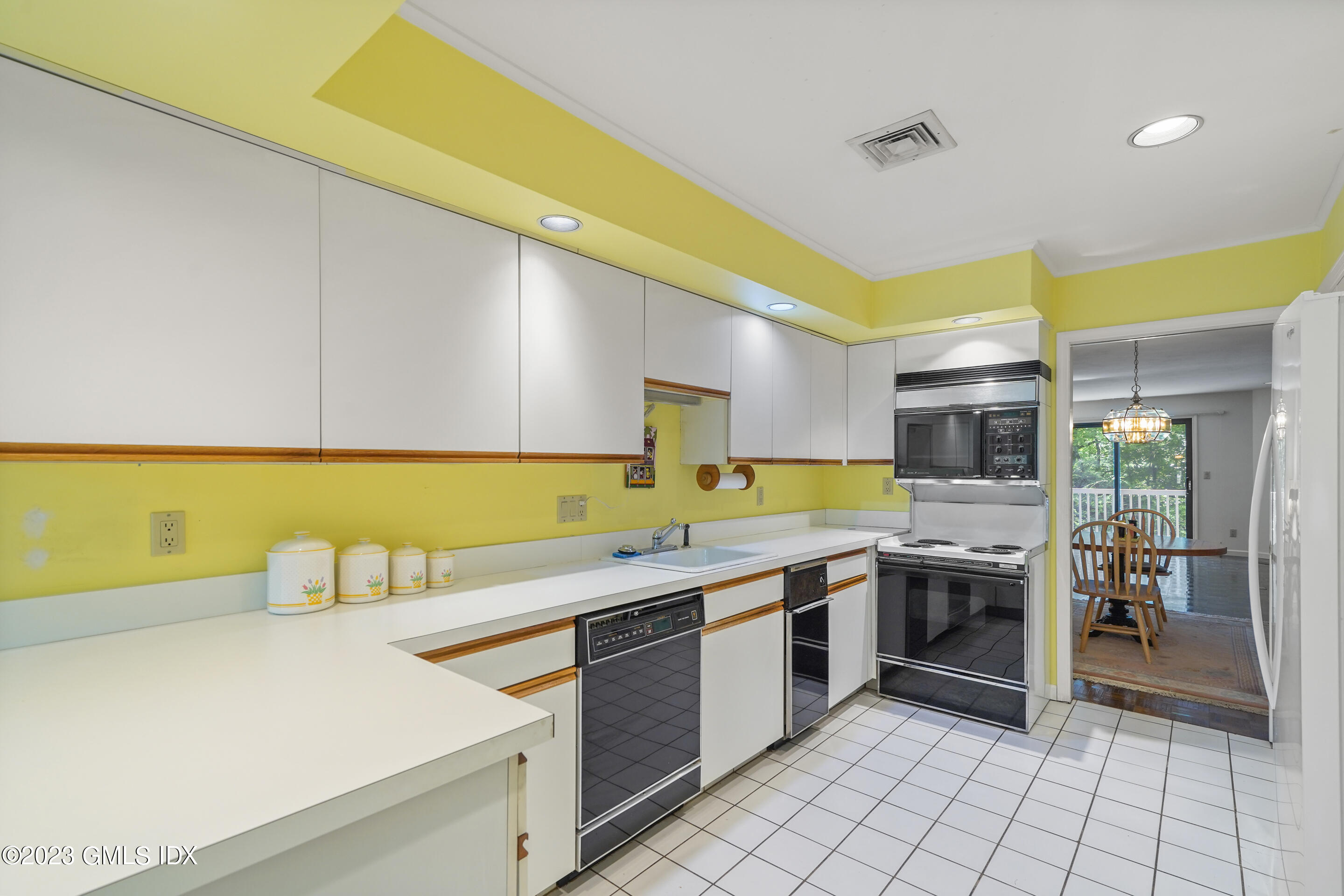 500 River Road, Unit 12 Cos Cob, CT 06807 - Photo 5 of 30 a kitchen with a sink and cabinets