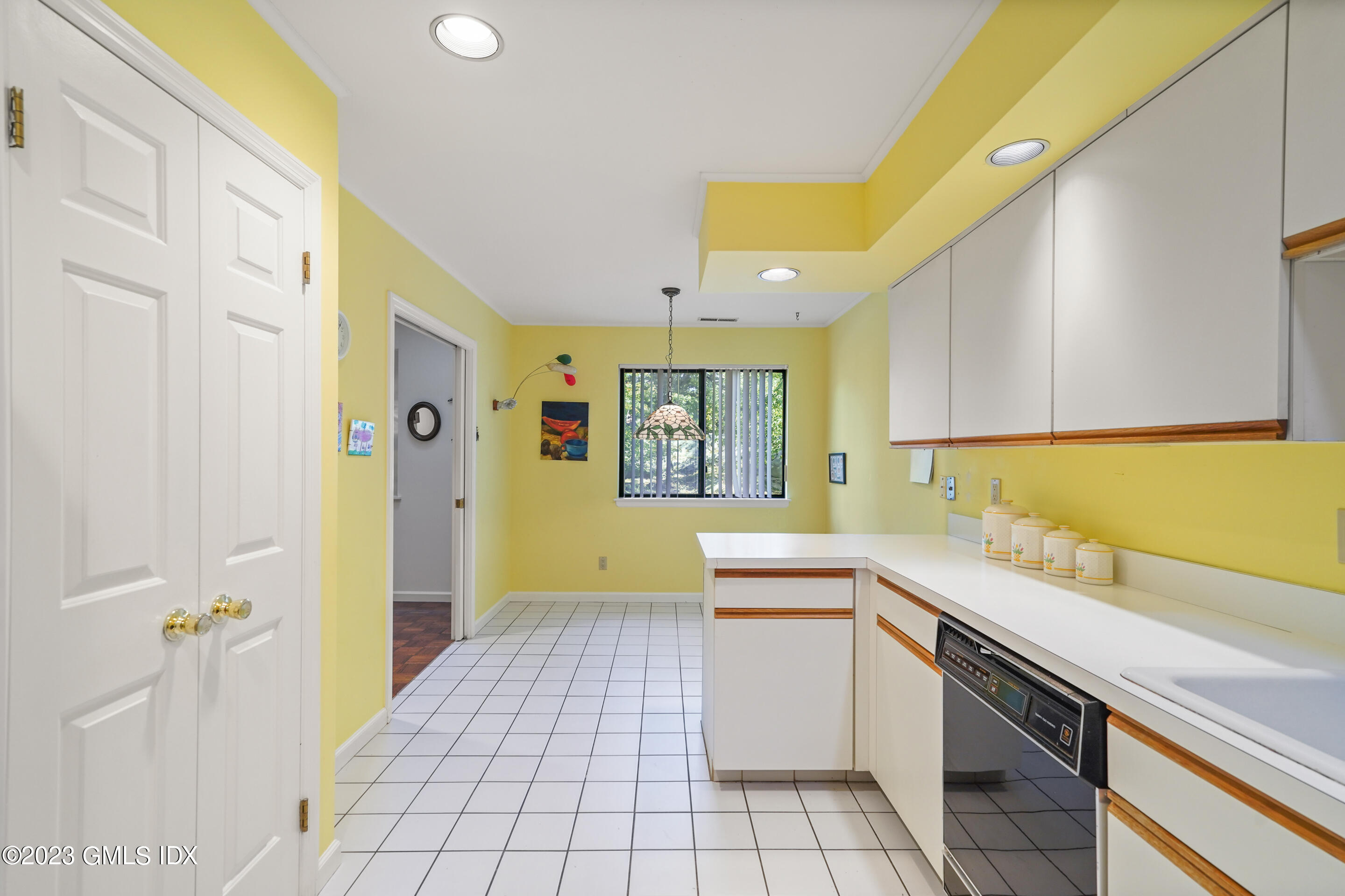 500 River Road, Unit 12 Cos Cob, CT 06807 - Photo 6 of 30 a kitchen with a sink and cabinets