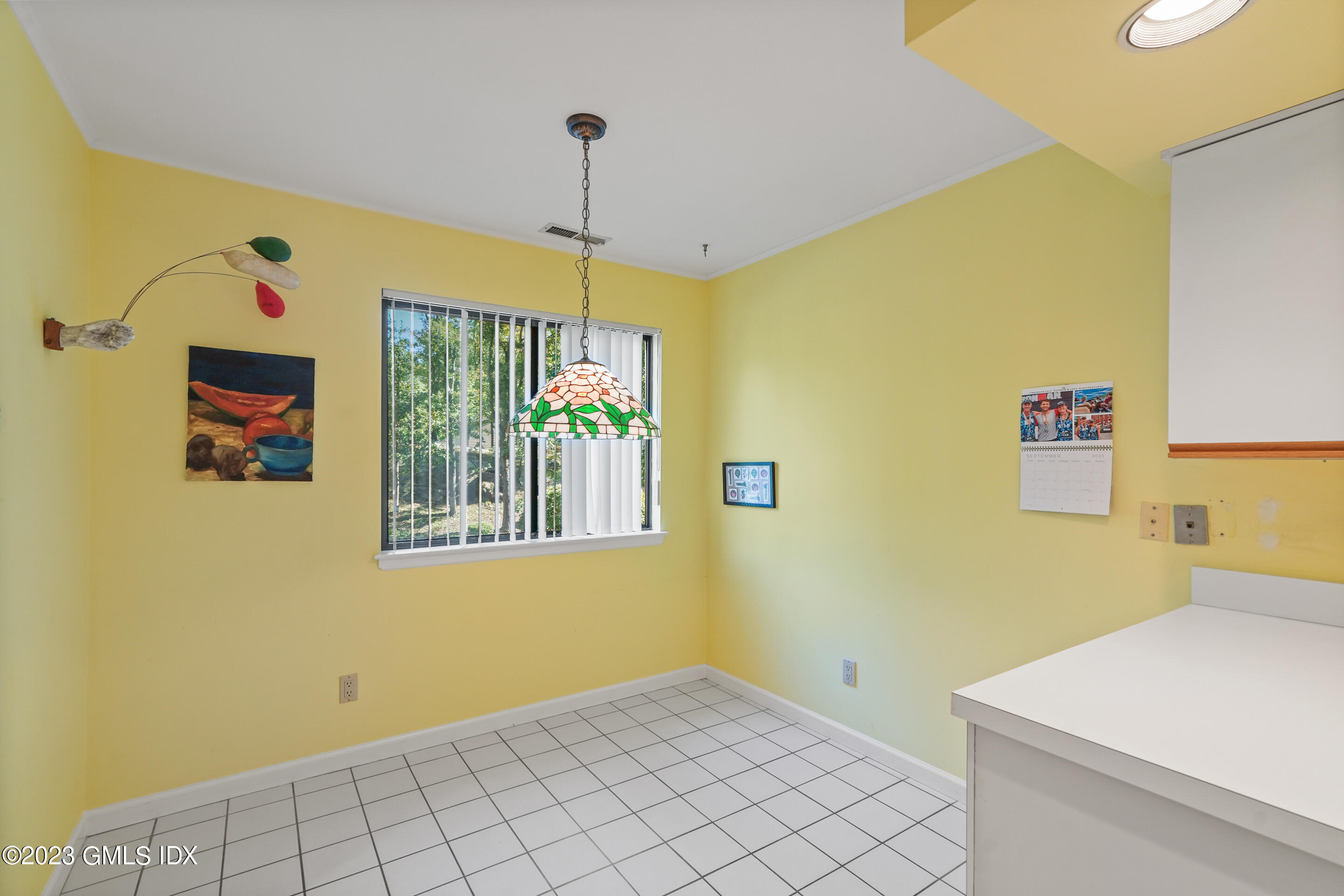 500 River Road, Unit 12 Cos Cob, CT 06807 - Photo 8 of 30 a view of an empty room with window and cabinet