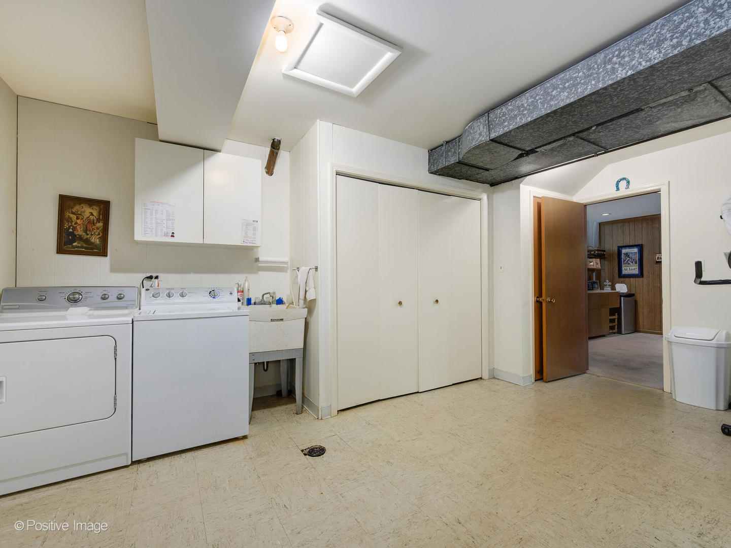 1107 Juniper Terrace Glenview, IL 60025 - Photo 21 of 30 a view of kitchen with cabinets and washer dryer
