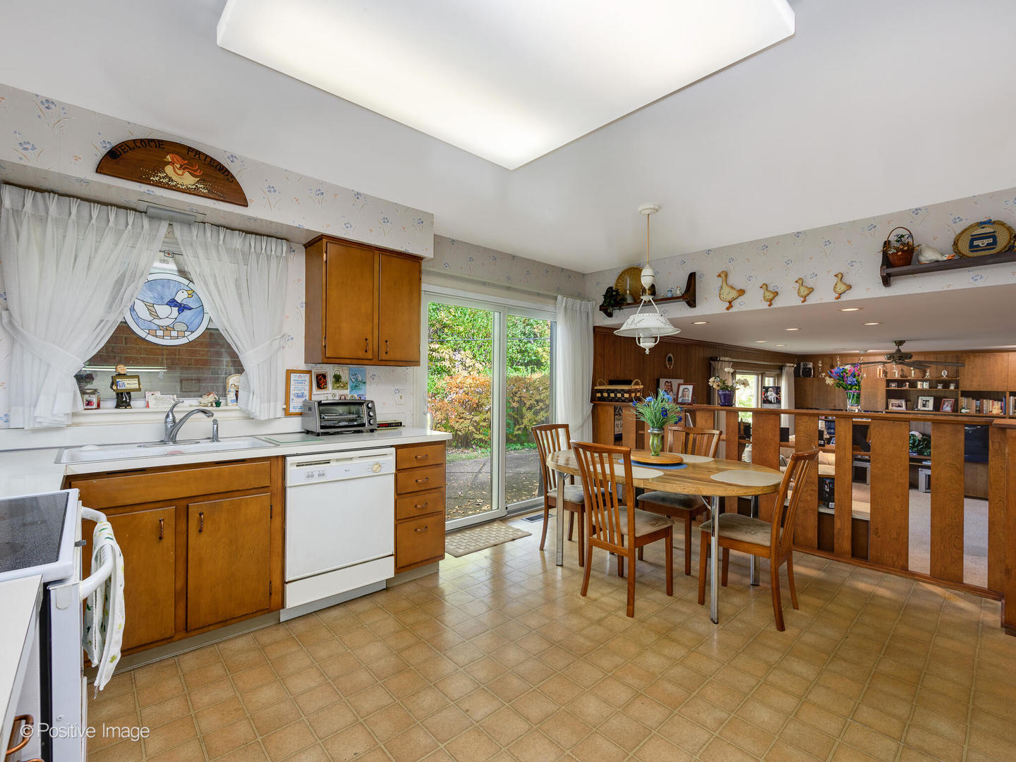 1107 Juniper Terrace Glenview, IL 60025 - Photo 10 of 30 a group of people sitting in a kitchen