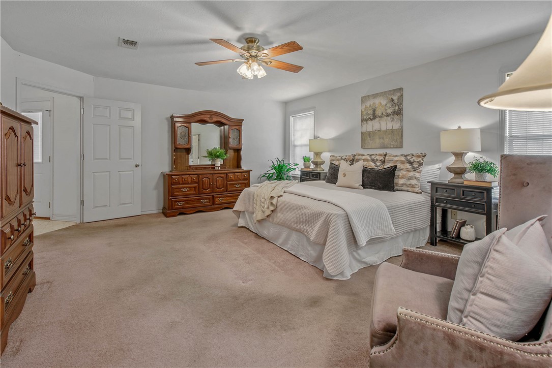 1110 County Road 439 Dime Box, TX 77853 - Photo 25 of 50 a spacious bedroom with a bed couch and window