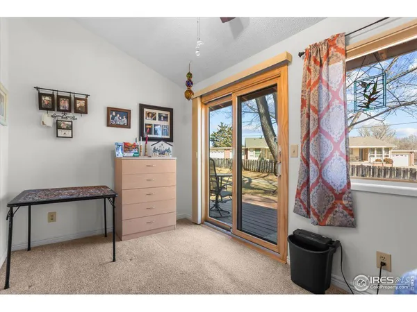 a view of a livingroom with furniture and windows