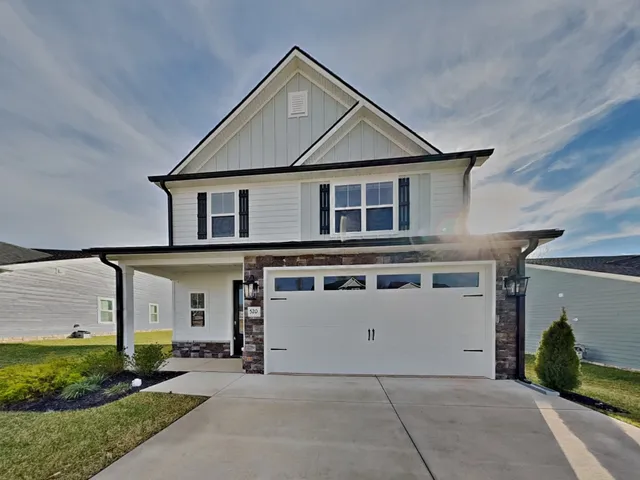 a front view of a house with a garage