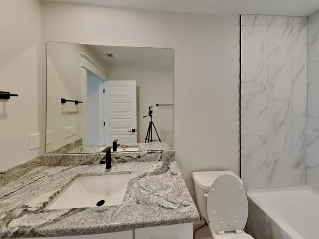 a bathroom with a sink and a toilet