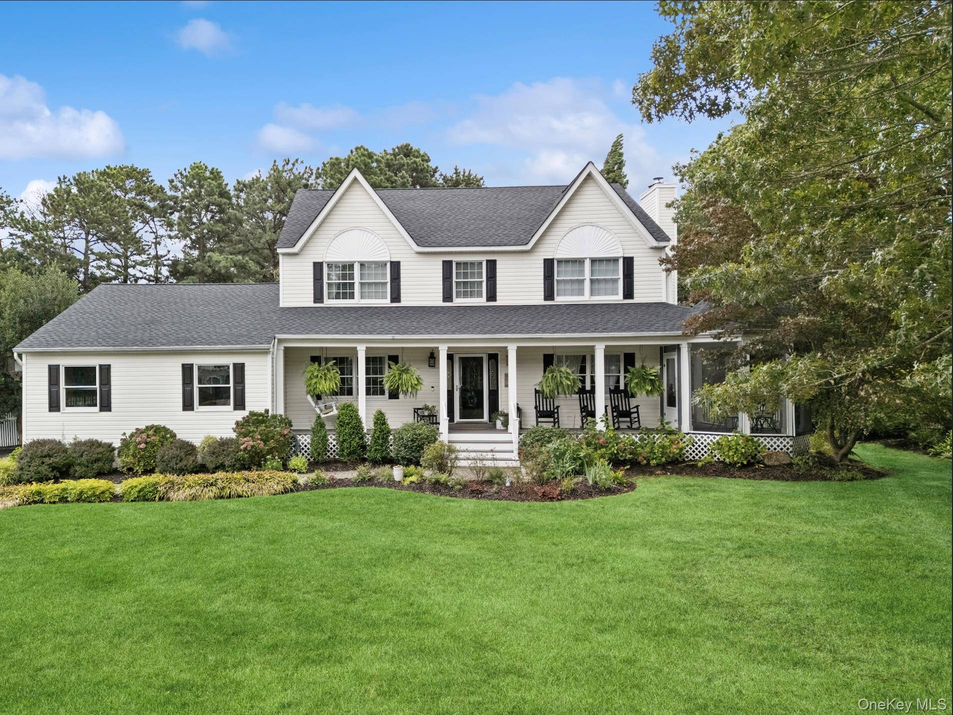 225 Hidden Acres Path Wading River, NY 11792 - Photo 1 of 1 a front view of a house with garden