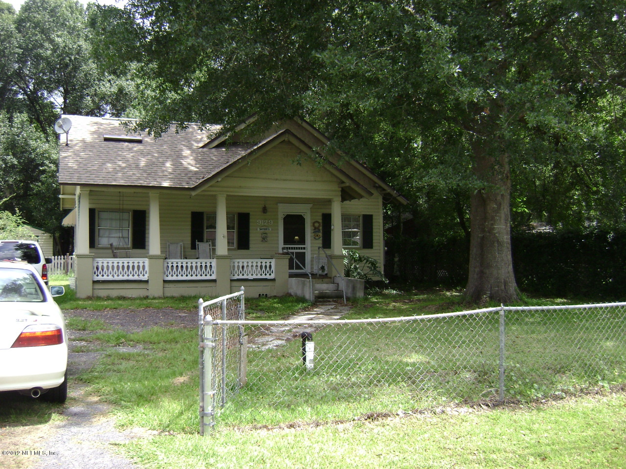 9129 Wild Road Jacksonville, FL 32220 - Photo 1 of 11 Home nestled under large oaks
