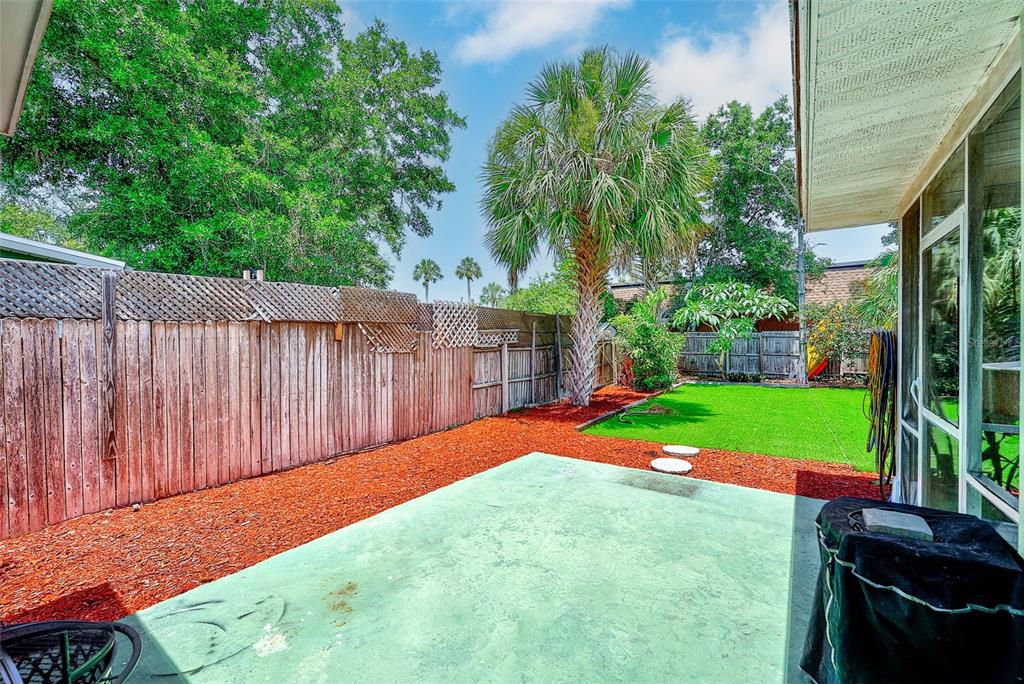 14079 Victoria Road Largo, FL 33774 - Photo 32 of 46 a view of a backyard with a garden