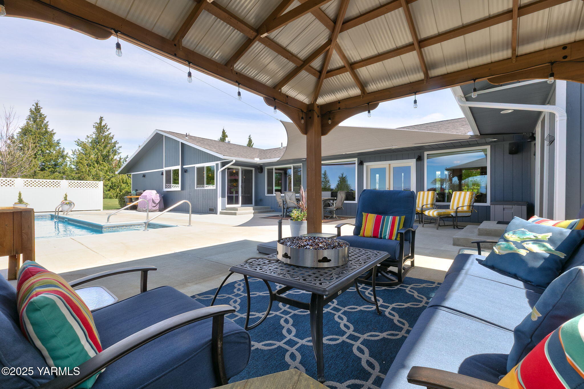 9370 Bittner Road Yakima, WA 98901 - Photo 28 of 38 a view of a patio with couches table and chairs with wooden floor and fence