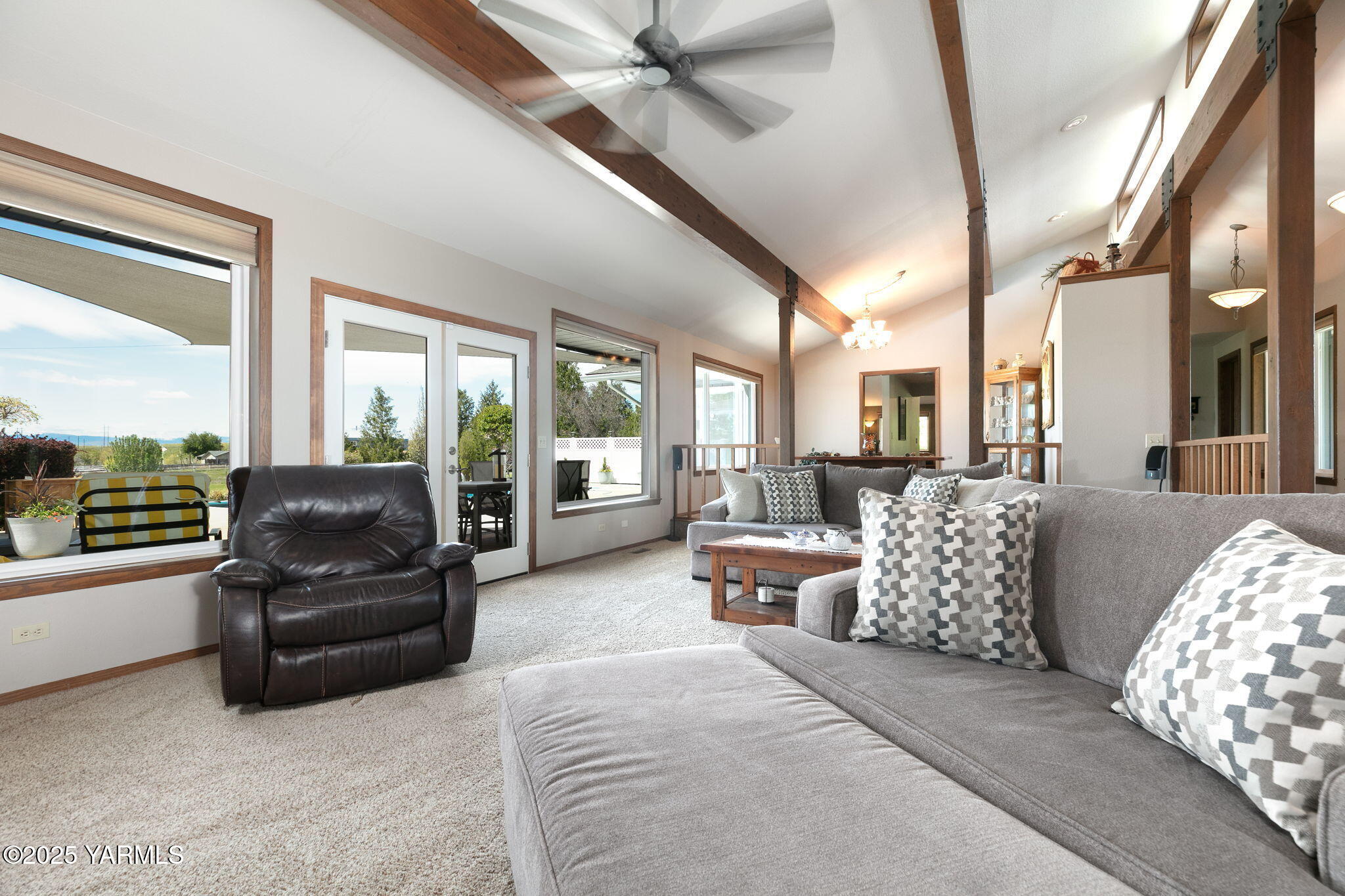 9370 Bittner Road Yakima, WA 98901 - Photo 6 of 38 a living room with furniture fireplace and large windows