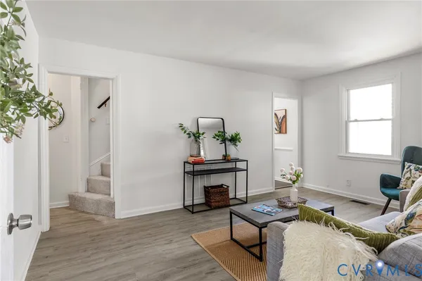 a living room with furniture and a table