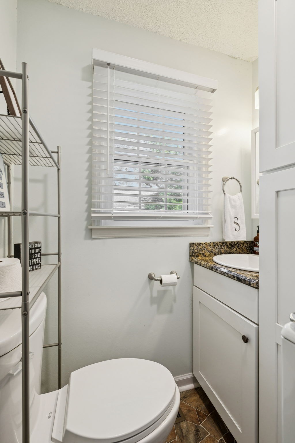 900 Ridge West Hermitage, TN 37076 - Photo 17 of 38 a bathroom with a sink a toilet and a window