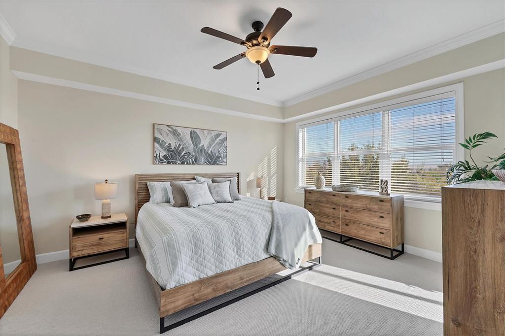 8541 Amberjack Circle, Unit 203 Englewood, FL 34224 - Photo 20 of 52 a bedroom with a bed dresser and a window