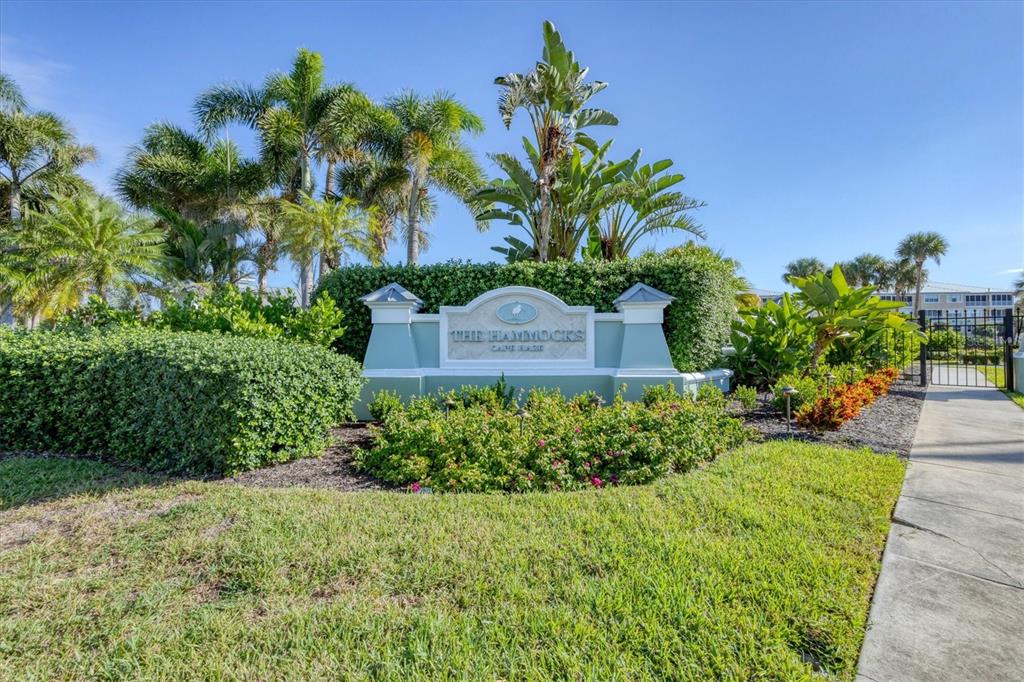 8541 Amberjack Circle, Unit 203 Englewood, FL 34224 - Photo 39 of 52 a view of a garden with a building in front of it