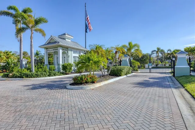 a view of a house with a swimming pool and a yard with potted plants