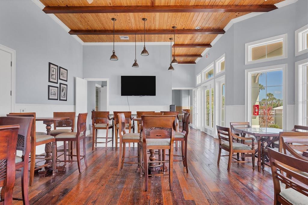 8541 Amberjack Circle, Unit 203 Englewood, FL 34224 - Photo 43 of 52 a view of a dining room with furniture and wooden floor