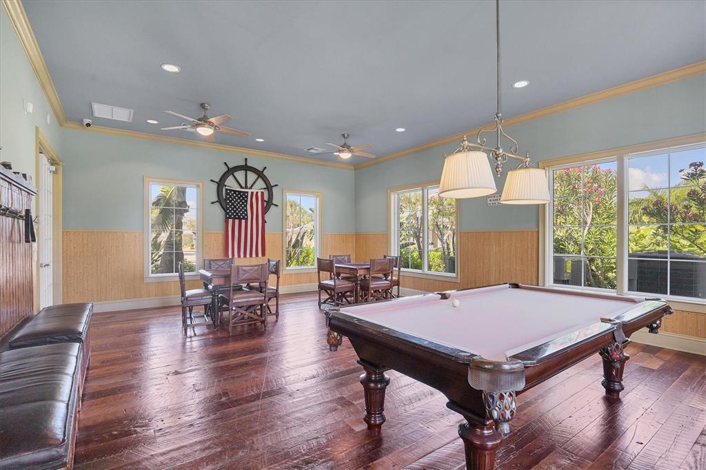 8541 Amberjack Circle, Unit 203 Englewood, FL 34224 - Photo 44 of 52 a view of a dining room with furniture window and wooden floor