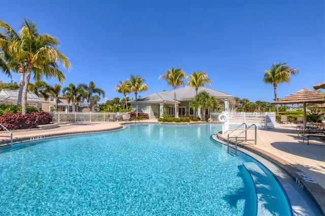 a view of a swimming pool with a patio