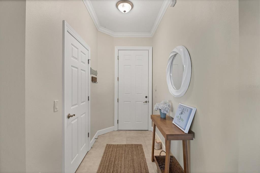 8541 Amberjack Circle, Unit 203 Englewood, FL 34224 - Photo 6 of 52 a view of a hallway with wooden floor and entryway