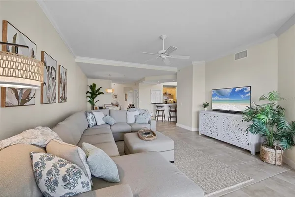 a living room with furniture and flowers
