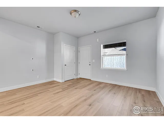 a kitchen with stainless steel appliances a refrigerator and a stove