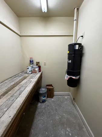 a room with a cabinet and gym equipment