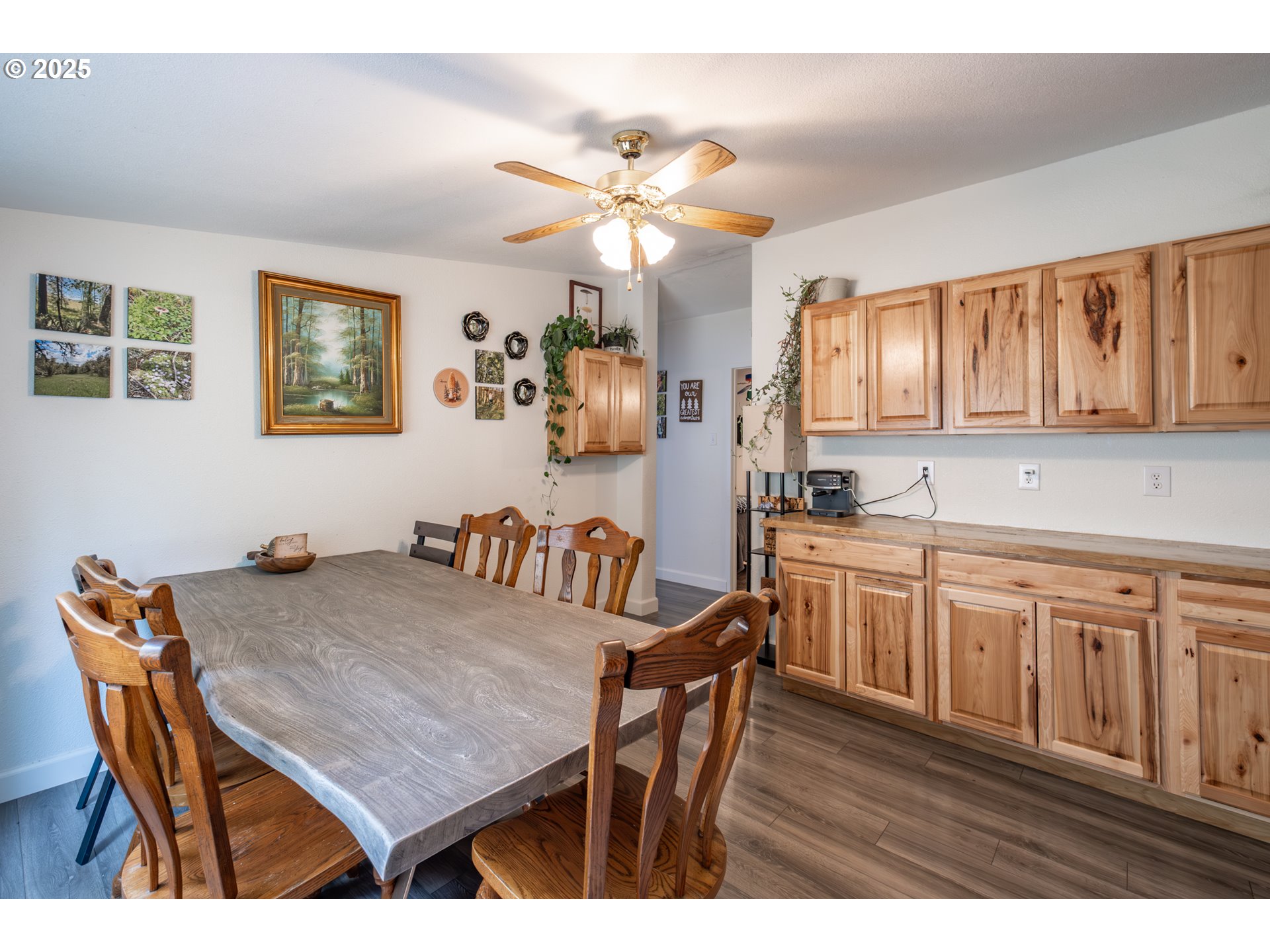 31101 Berlin Road Lebanon, OR 97355 - Photo 12 of 41 a kitchen with granite countertop a dining table chairs and white cabinets
