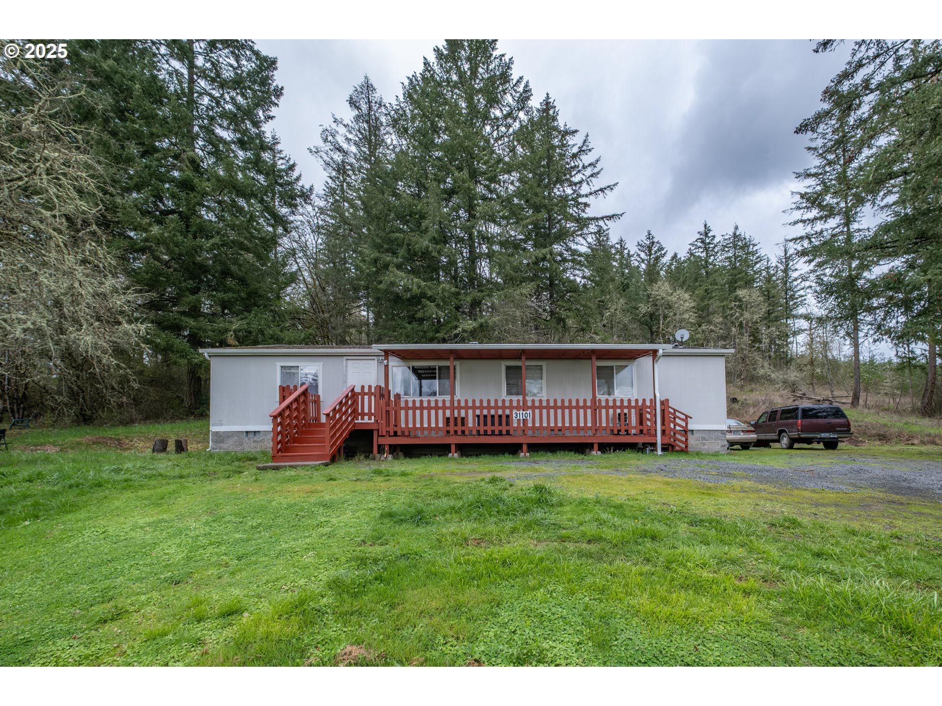 31101 Berlin Road Lebanon, OR 97355 - Photo 30 of 41 a view of a house with a yard and sitting area