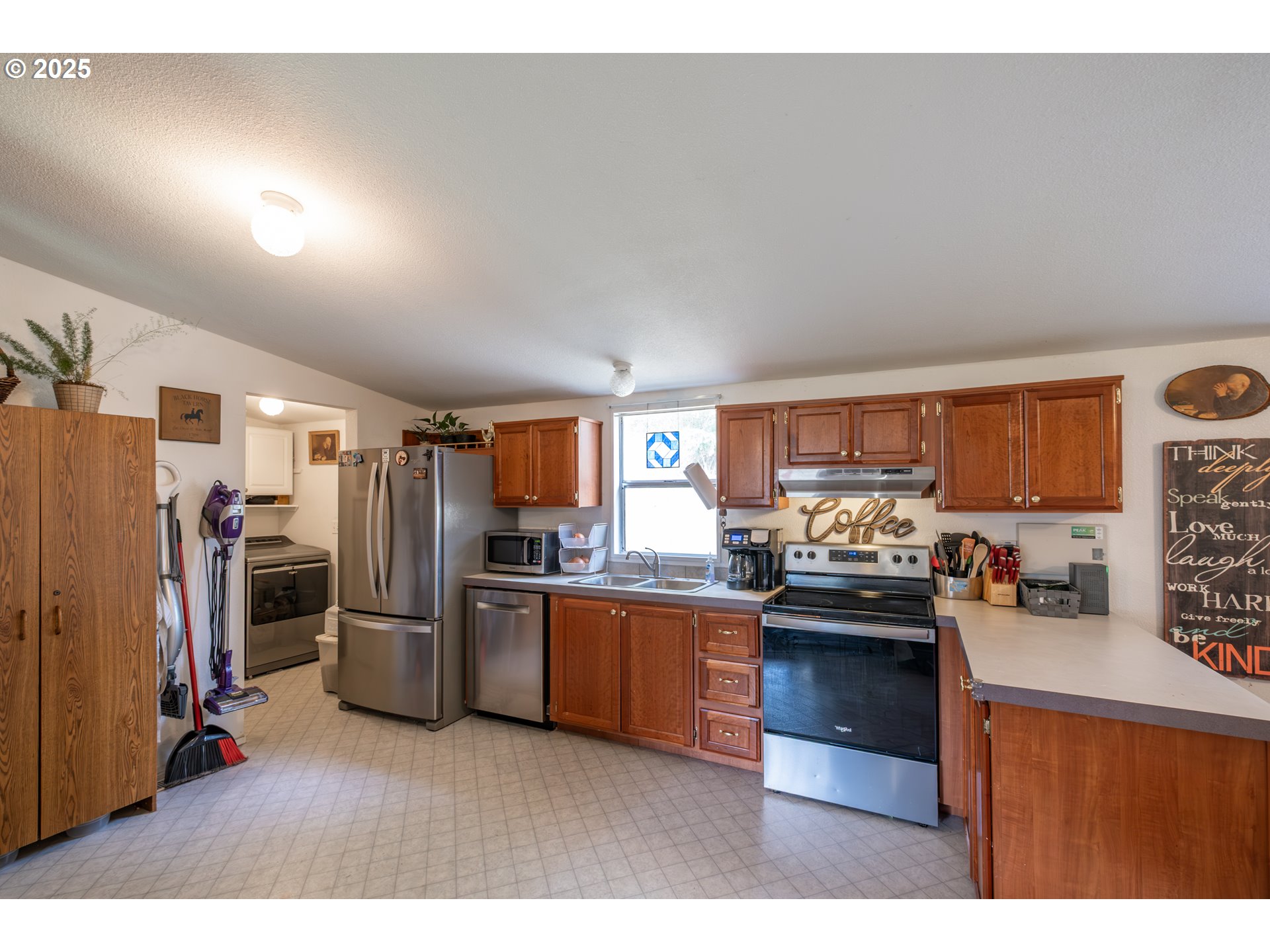 31101 Berlin Road Lebanon, OR 97355 - Photo 4 of 41 a kitchen with stainless steel appliances kitchen island granite countertop a refrigerator stove and sink